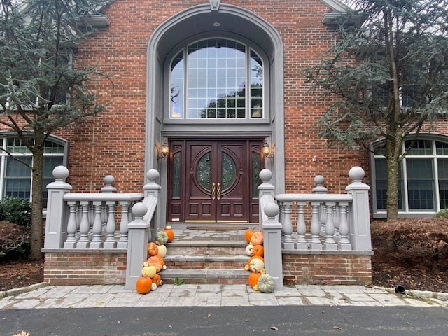 Fall porch with mums and pumpkins