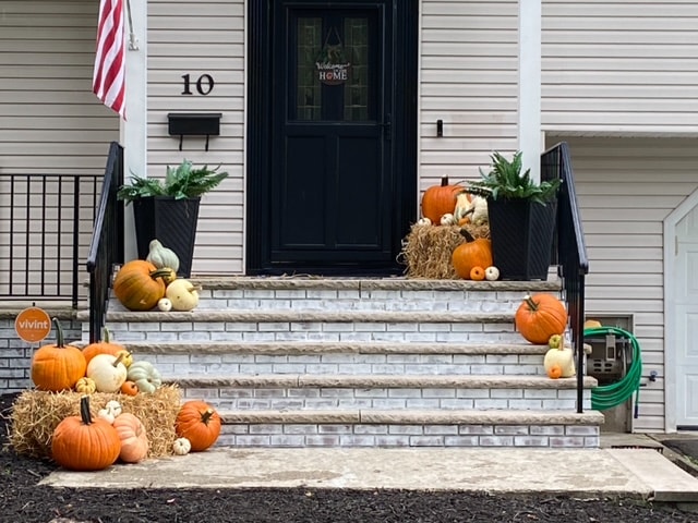 Holiday porch with Christmas greenery and lights