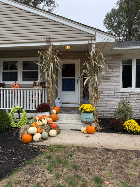 Winter holiday home exterior with wreath and lights